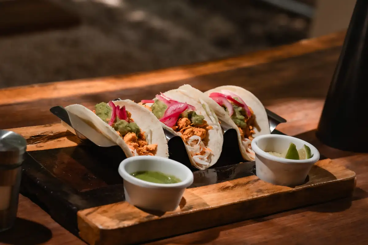 Plate of Mexican tacos with salsas